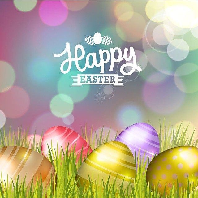 The words " Happy Easter" above multi coloured eggs sitting on grass